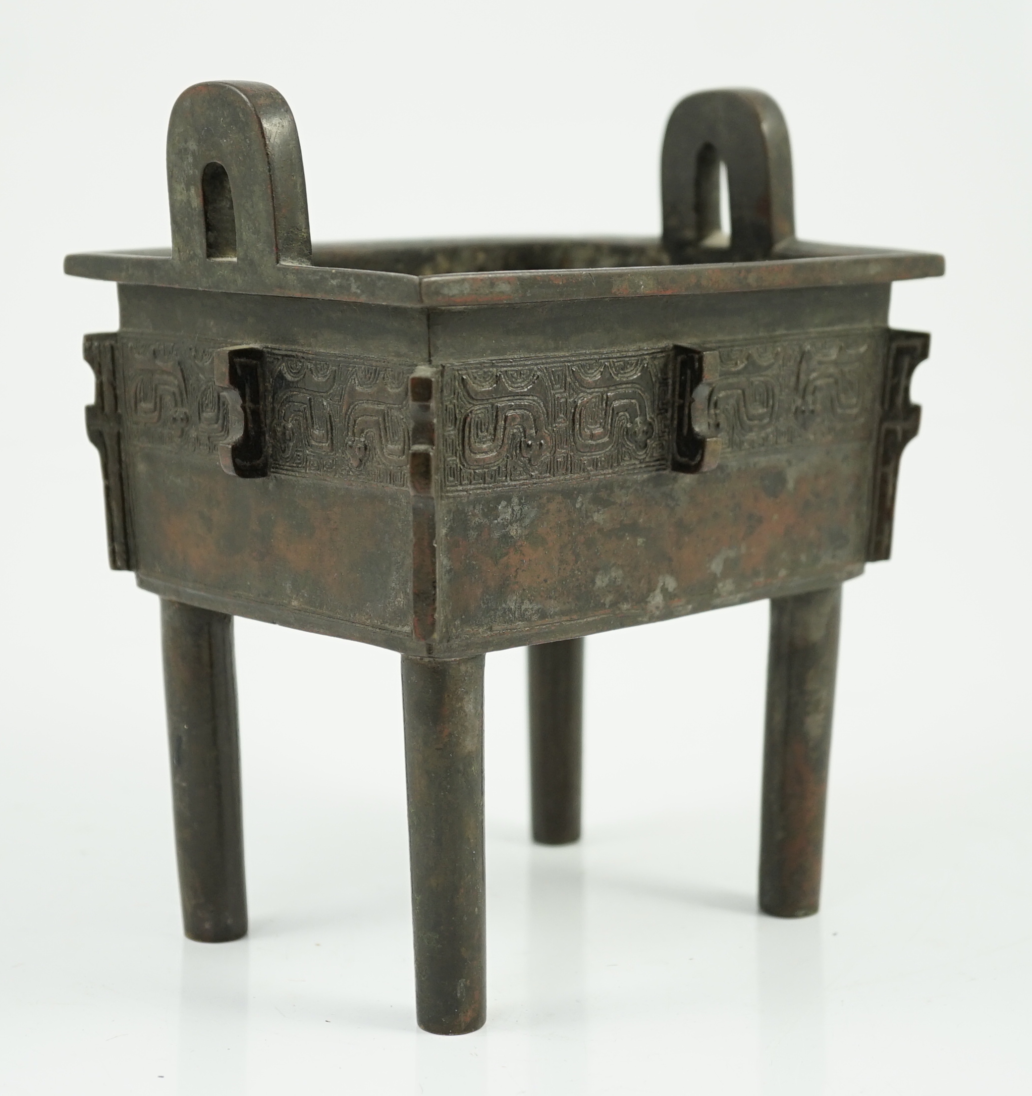 A Chinese archaistic bronze vessel, fangding, 17th/18th century, old repair to one leg